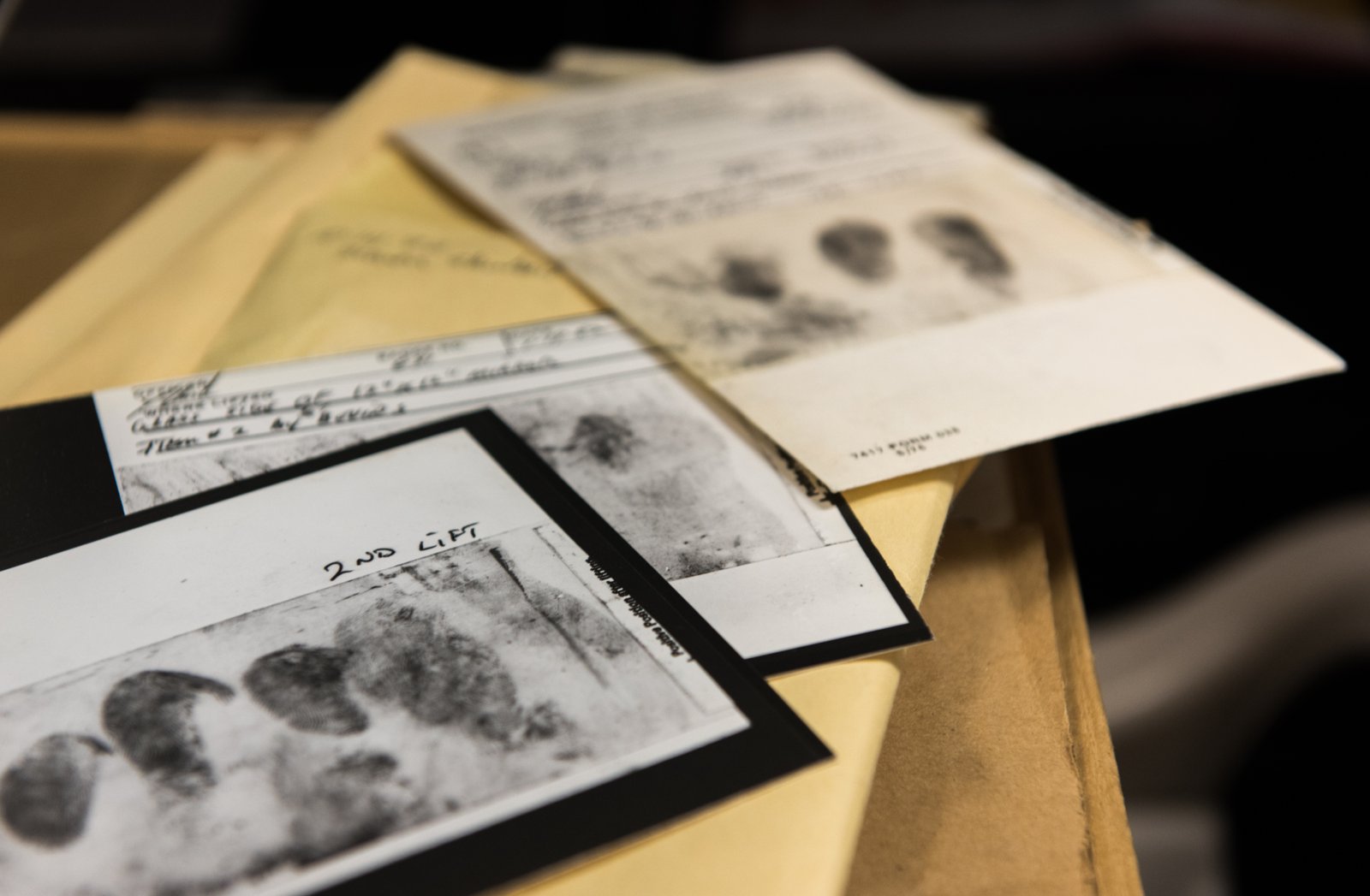 FBI photograph of fingerprint lift cards and evidence envelopes from the East Area Rapist cold case files.